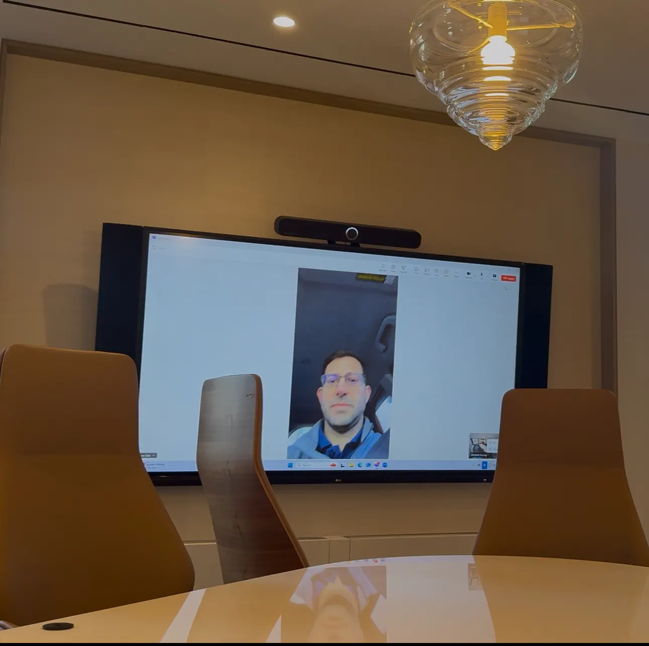 Meeting room display with a video bar above it